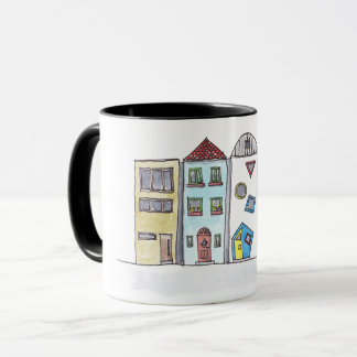 Tasse avec des maisons urbaines