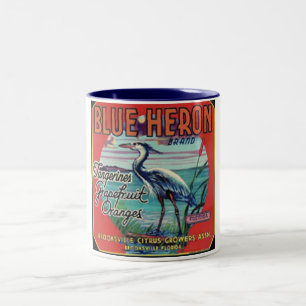 tasse bleue de marque de héron