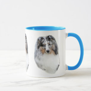 Tasse bleue de tête de merle de chien de berger d