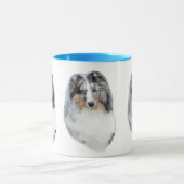 Tasse bleue de tête de merle de chien de berger de (Centre)