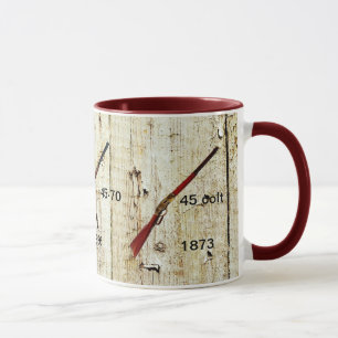 Tasse de café avec les fusils qui ont gagné