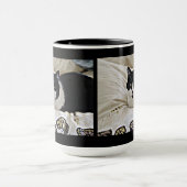 Tasse de café noire et blanche précieuse de Milo (Centre)