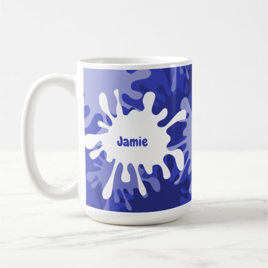 Tasse de thé avec éclaboussure de peinture bleue a (Gauche)