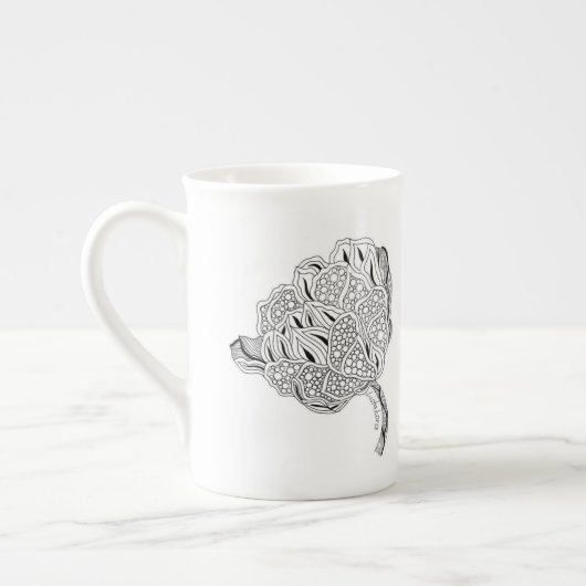 Tasse de thé de porcelaine tendre de fleur de (Gauche)