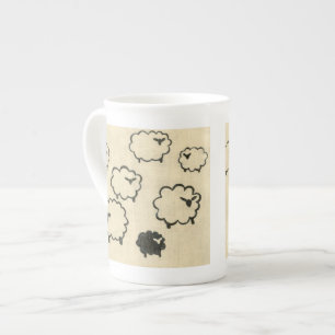 Tasse En Porcelaine Mouton blanc et noir sur Arrière - plan crème