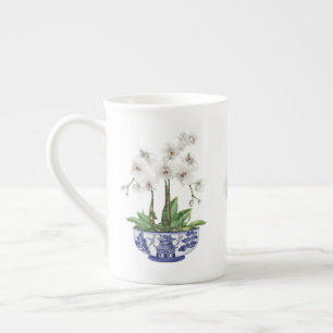 Tasse En Porcelaine Orchidée blanche dans un bol en céramique de style