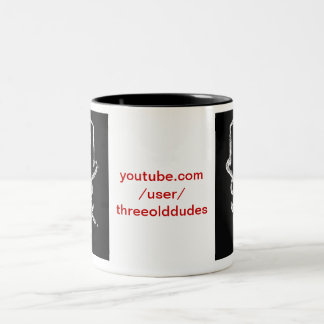 Tasse foncée de logo de trois vieux types