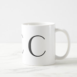 Tasse noire d'art déco du monogramme C