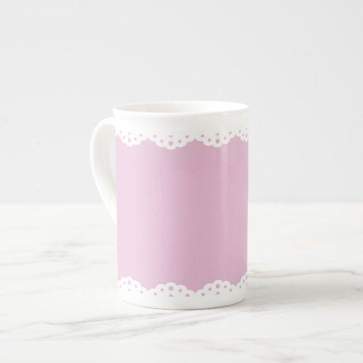 Tasse rose de porcelaine tendre d'équilibre (Devant gauche)