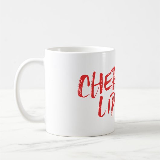 Tasse rouge de marque de baiser de lèvres de (Gauche)
