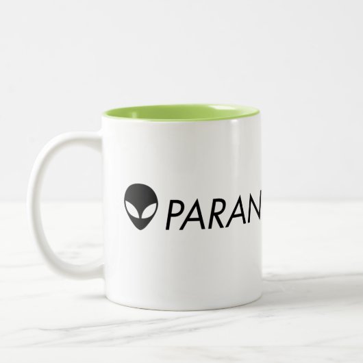 Tasse verte étrangère de Paranormalis (Gauche)