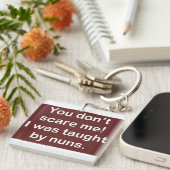 Taught by Nuns in Dark Sleutelhanger (Voorkant Rechts)