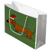 Teckel drôle dans le sac de cadeau de Noël de (Devant Angle)