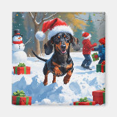 Teckel loopt in de sneeuw met kerst Pet Magneet (Voorkant)