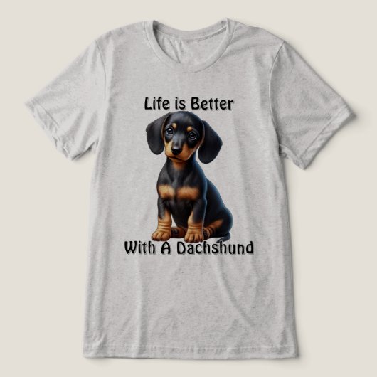 Teckel Puppy Zittend en Kijkend met Onschuldig Tri-Blend Shirt (Design voorkant)
