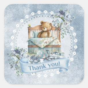  teddybeer in wieg blauw en bruine bloemen vierkante sticker
