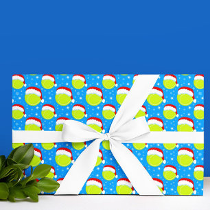 Tennisballen dragen Santa's hoed en sneeuwvlokken Cadeaupapier