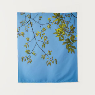 Tenture belle branche avec des feuilles vertes et jaunes é