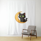 Tenture Chat noir souriant aux yeux verts brillants assis (En situation)