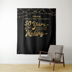 Tenture Fond photographique noir et or pour le 50e anniver