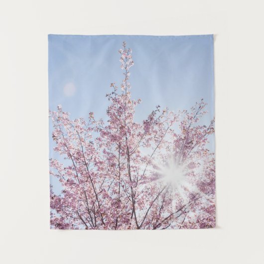 Tenture sun rays pass through pink flowers of a wow tree (Devant)