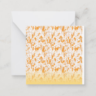 Textielpatroon met een levendig oranje en goud notitiekaartje