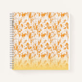 Textielpatroon met een levendig sinaasappel en gou notitieboek (Voorkant)