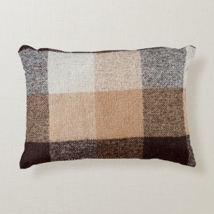 textuur van bruin gevriesdroogde wolvlies. tartan accent kussen