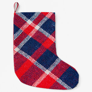 Textuur van rood en blauw, gevriesdroogd weefsel v kleine kerstsok