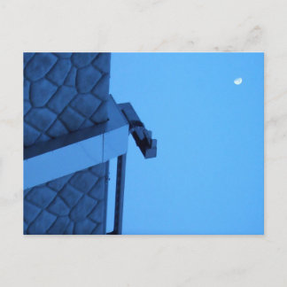 The moon hangs above the breakwater. briefkaart