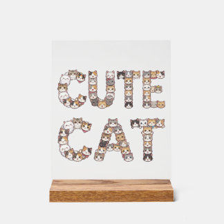 The words "CUTE CAT" are made using cat faces