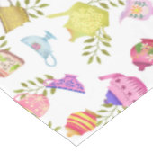 Thee potten en kopjes wit tafelkleed (Gekanteld)