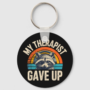 Therapeut laat wasbeer met koptelefoon los retro sleutelhanger
