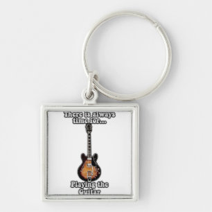 There is always time for playing the guitar. retro sleutelhanger