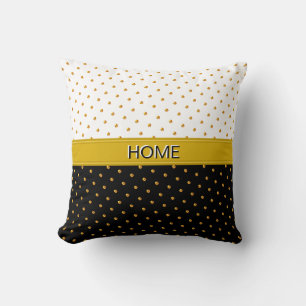 Thuis en gouden polka stippen op zwart en wit kussen