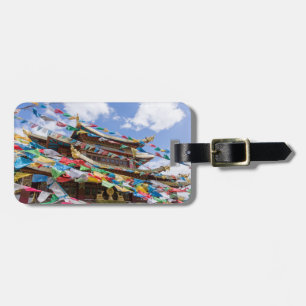 Tibetaanse tempel met gebedvlaggen - Yunnan, China Bagagelabel