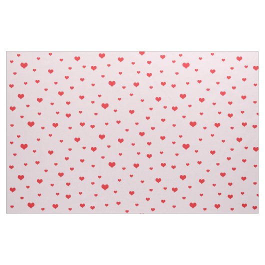 Tissu Coeurs rouges éparpillés sur couleur rose pâle (Yard)