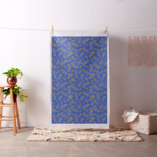 Tissu Feuilles d'or satiné sur fond de bleu céruléen