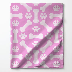 Tissu Motif d'os de chien et d'empreintes de pattes rose