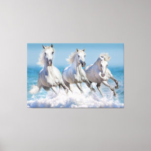 Toile Andalusian white horses run in the waves