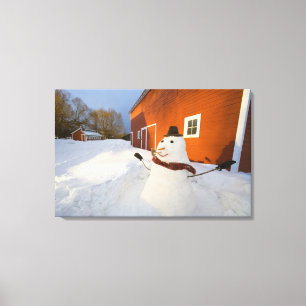 Toile Bonhomme de neige devant la grange rouge en