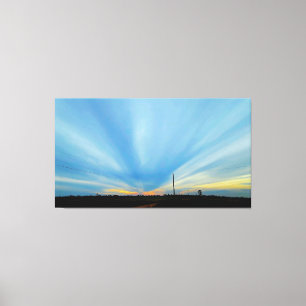 Toile Coucher de soleil dramatique sur un paysage rural