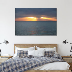 Toile Coucher de soleil sur l'océan brisant les nuages