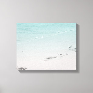 Toile Empreintes de pas dans le sable avec l'océan sur