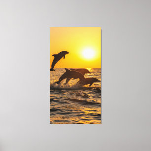 Toile groupe de dauphins saute joyeusement des vagues