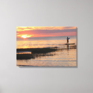 Toile Homme sur une planche à eau au coucher du soleil s