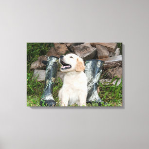 Toile Jeune chiot Golden Retriever et bottes de chasse