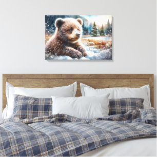Toile Jeune ourson brun dans la neige hivernale et les p