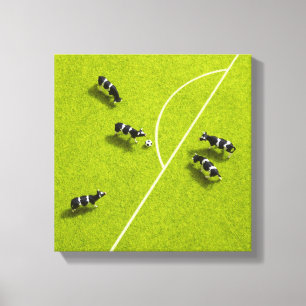 Toile Les vaches jouant au football