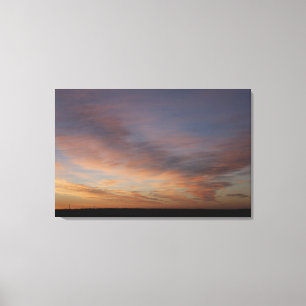 Toile Nuages dans un ciel orange au lever de soleil